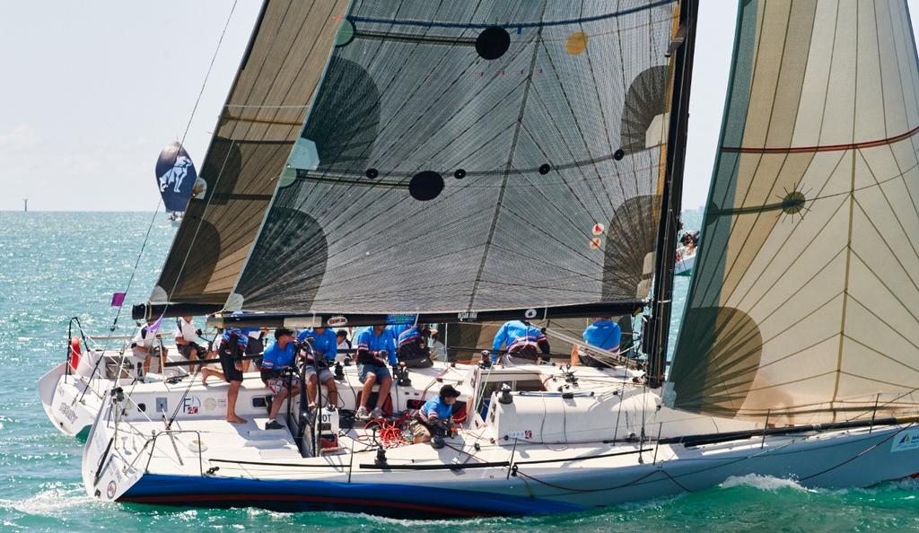 Townsville’s Guilty Pleasures in close quarter battle with Sydney entry Kerazy in Race 1 of today’s SeaLink Magnetic Island Race Week competition.  © John De Rooy